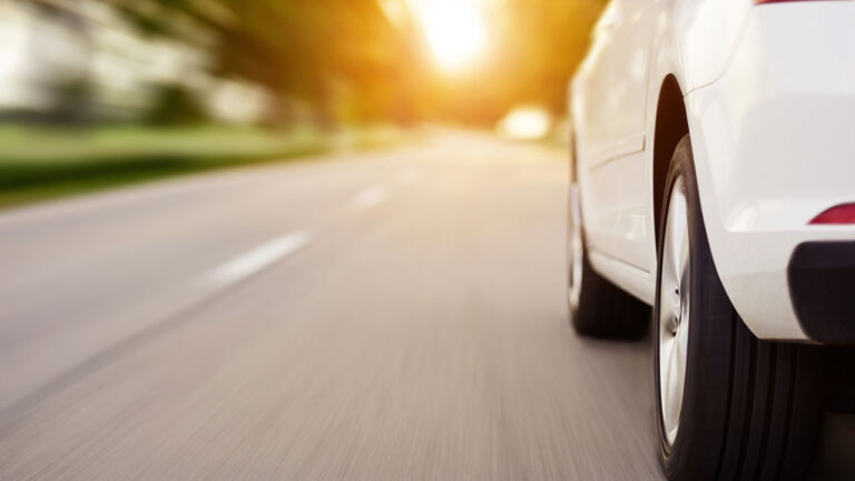 White Car driving on road