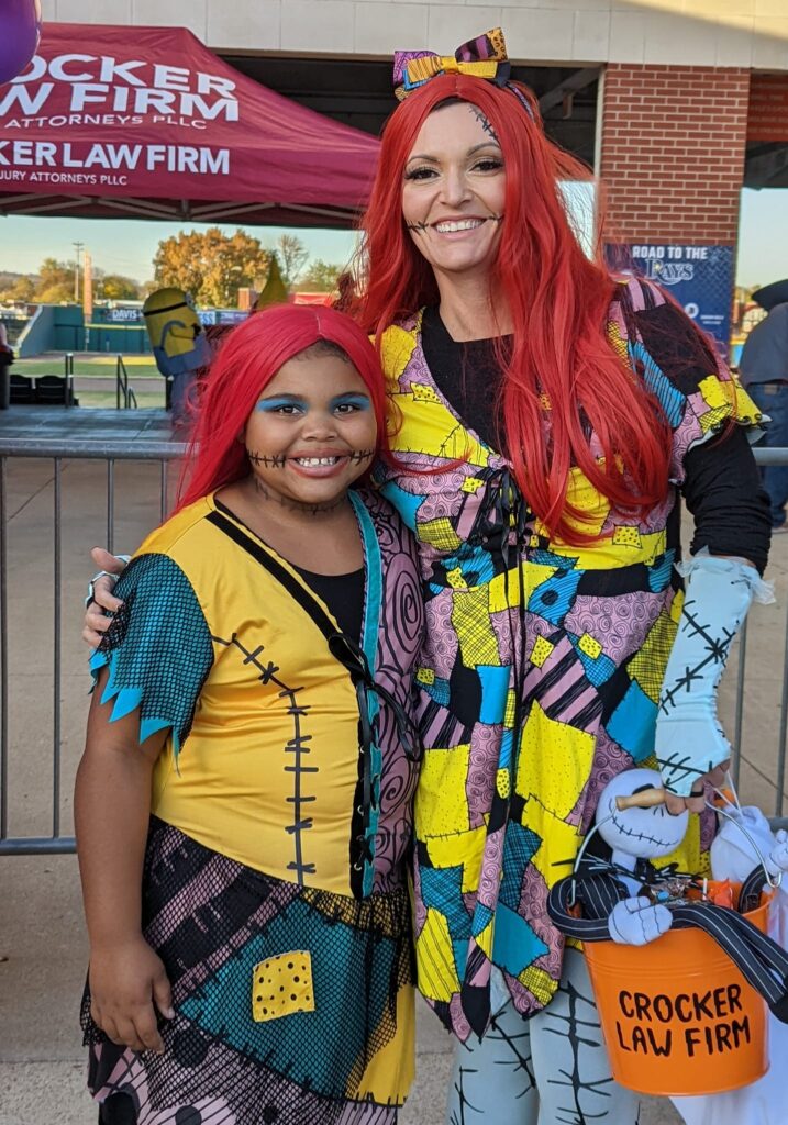 An adult female and young female both dressed as Sally from Nightmare Before Christmas at Rockin' Trick or Treat