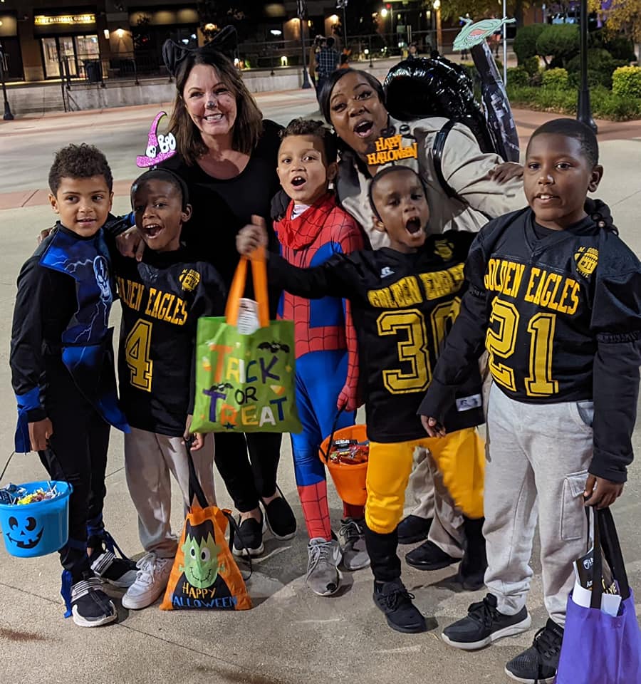 A family dressed up in football uniforms at Rockin' Trick or Treat